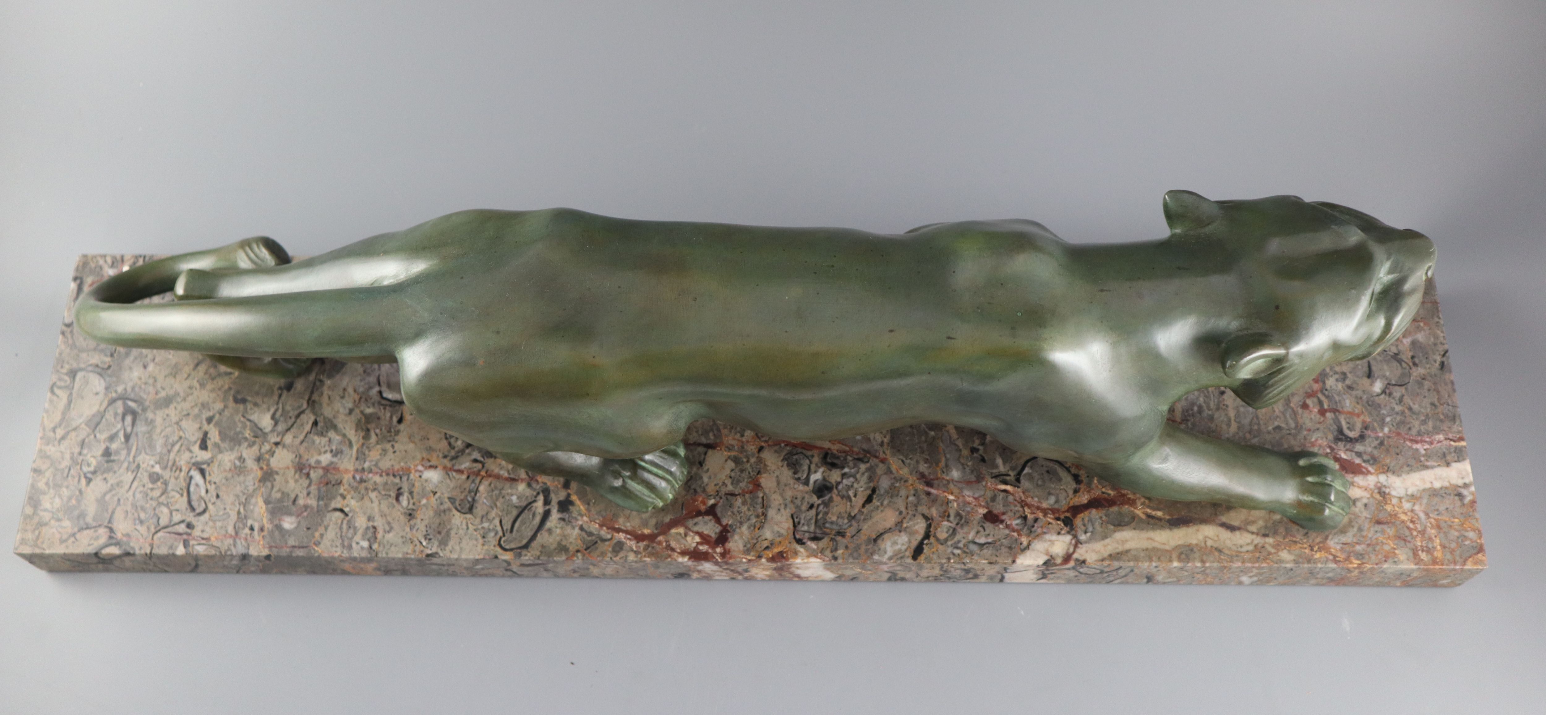 Brault. An Art Deco patinated bronze model of a prowling panther, width 29.5in. height 8.5in.